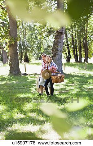 Stock Photograph - Couple walking in park. Fotosearch