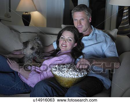 Couple watching movie together View Large Photo Image Stock Image - Couple watching movie together. Fotosearch