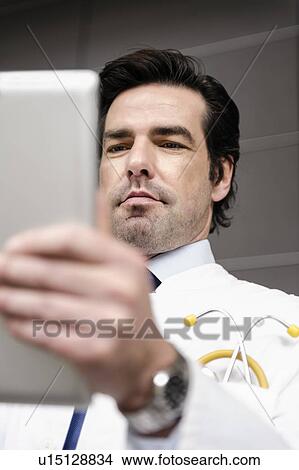 Picture - Doctor using tablet computer. Fotosearch