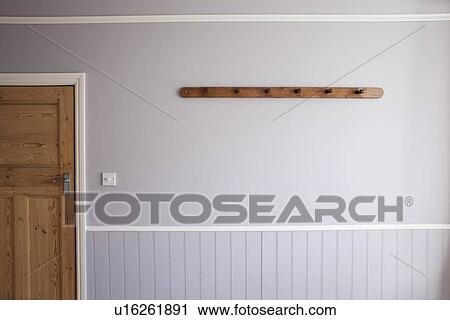 Empty coat rack on wall View Large Photo Image Stock Image - Empty coat rack on wall. Fotosearch
