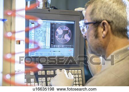 Engineer using computer in factory View Large Photo Image Stock Photo - Engineer using computer in factory. Fotosearch