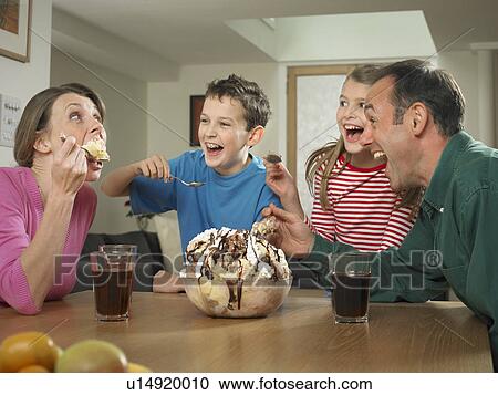 Family eating ice cream together View Large Photo Image Stock Image - Family eating ice cream together. Fotosearch