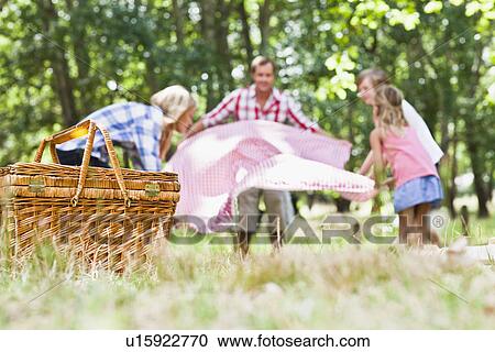 Family having picnic in park View Large Photo Image Stock Image - Family having picnic in park. Fotosearch