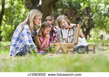 Family having picnic in park View Large Photo Image Stock Image - Family having picnic in park. Fotosearch