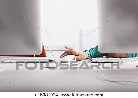 Girl using computer at desk View Large Photo Image Picture - Girl using computer at desk. Fotosearch