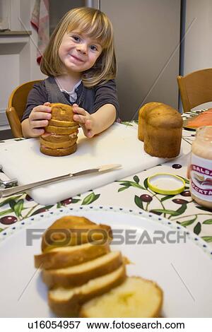 Girl with plate of sliced cake View Large Photo Image Stock Photo - Girl with plate of sliced cake. Fotosearch