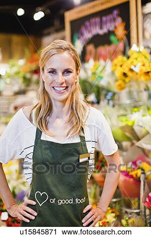 Grocer smiling in florist section View Large Photo Image Stock Image - Grocer smiling in florist section. Fotosearch