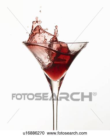 Ice cube splashing in cocktail glass View Large Photo Image Stock Image - Ice cube splashing in cocktail glass. Fotosearch