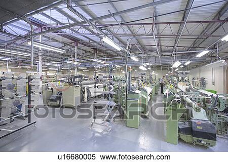 Stock Photography - Industrial looms in textile mill. Fotosearch