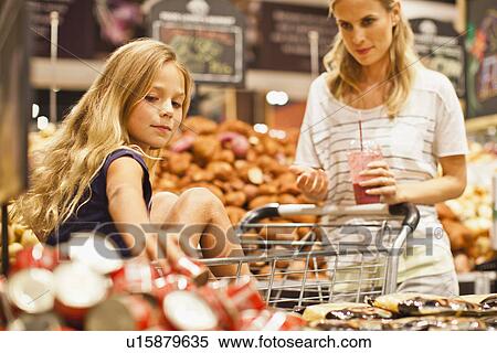 Mother and daughter in grocery store View Large Photo Image Stock Photography - Mother and daughter in grocery store. Fotosearch