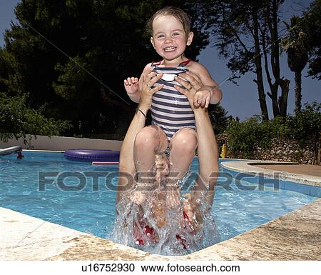 Mother and daughter in swimming pool View Large Photo Image Stock Image - Mother and daughter in swimming pool. Fotosearch