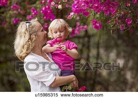 Mother and daughter picking flowers View Large Photo Image Stock Photography - Mother and daughter picking flowers. Fotosearch
