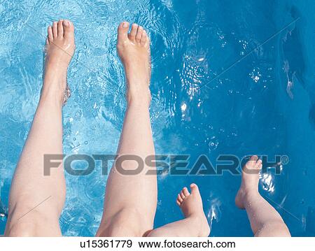Mother and son playing in swimming pool View Large Photo Image Stock Photo - Mother and son playing in swimming pool. Fotosearch