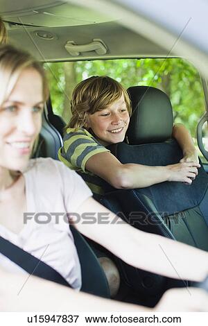 Stock Photo - Mother and son riding in car. Fotosearch