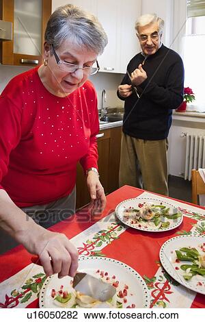 Older couple having dinner together View Large Photo Image Stock Image - Older couple having dinner together. Fotosearch