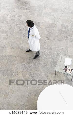 Overhead view of doctor in lobby View Large Photo Image Stock Photograph - Overhead view of doctor in lobby. Fotosearch