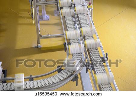 Stock Image - Packed biscuits on line in factory. Fotosearch