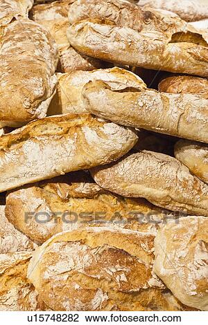 Pile of crusty bread loaves View Large Photo Image Stock Image - Pile of crusty bread loaves. Fotosearch