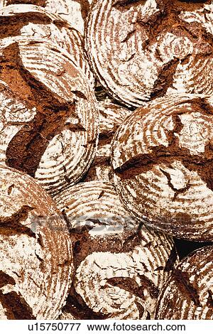 Pile of crusty bread loaves View Large Photo Image Stock Photo - Pile of crusty bread loaves. Fotosearch