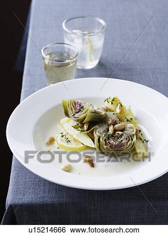 Stock Photograph - Plate of artichoke and lemon salad. Fotosearch