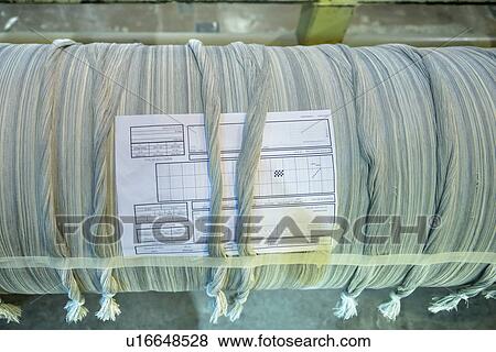 Roll of yarn at textile mill View Large Photo Image Stock Photo - Roll of yarn at textile mill. Fotosearch