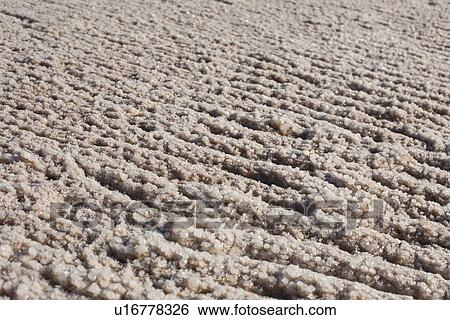Stock Photograph - Salt crystals on shore of Dead Sea, Israel. Fotosearch