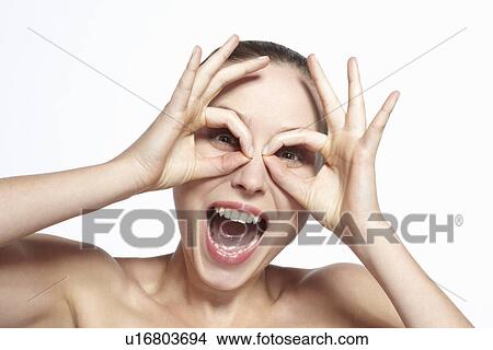 Picture - Smiling woman making face. Fotosearch