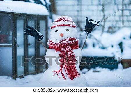 Snowman built on city street View Large Photo Image Stock Photography - Snowman built on city street. Fotosearch