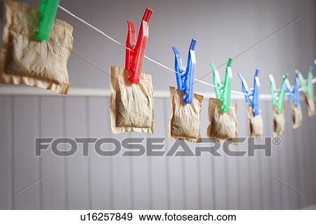 Stock Photo - Teabags hanging from clothesline. Fotosearch
