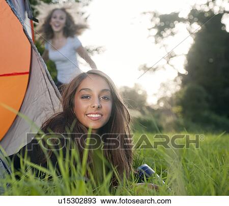 Teenage girl laying in tent at campsite View Large Photo Image Stock Image - Teenage girl laying in tent at campsite. Fotosearch