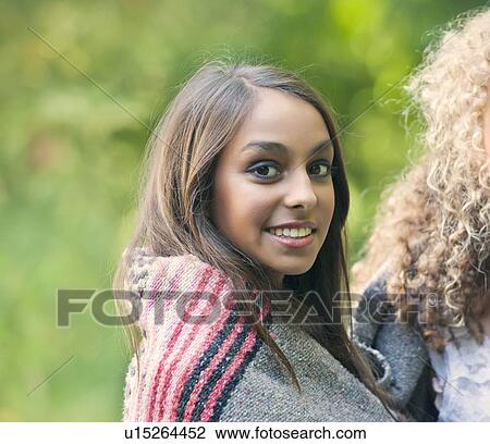Teenage girl wrapped in blanket View Large Photo Image Stock Image - Teenage girl wrapped in blanket. Fotosearch