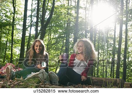 Teenage girls having picnic in forest View Large Photo Image Stock Photography - Teenage girls having picnic in forest. Fotosearch