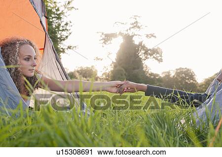 Teenage girls holding hands at campsite View Large Photo Image Stock Image - Teenage girls holding hands at campsite. Fotosearch