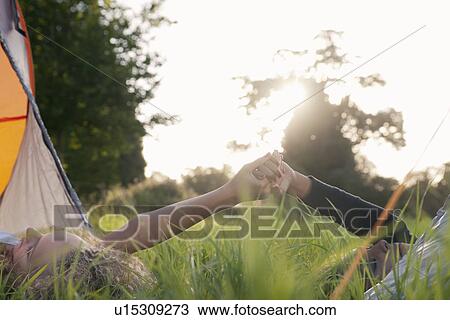 Teenage girls holding hands at campsite View Large Photo Image Stock Image - Teenage girls holding hands at campsite. Fotosearch