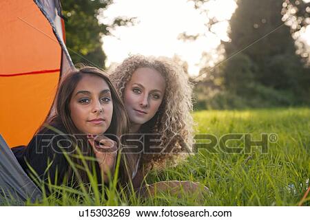 Teenage girls laying in tent at campsite View Large Photo Image Stock Photo - Teenage girls laying in tent at campsite. Fotosearch