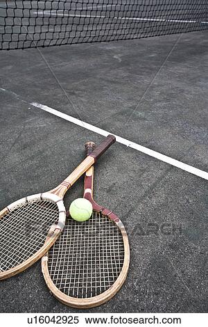 Tennis rackets and ball on court View Large Photo Image Stock Photography - Tennis rackets and ball on court. Fotosearch