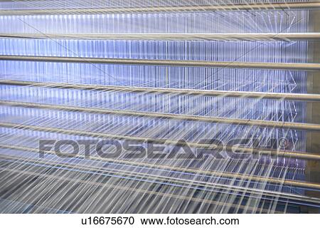 Threads on loom in textile mill View Large Photo Image Stock Image - Threads on loom in textile mill. Fotosearch
