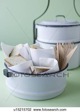 Stock Image - Tiffin tin with crusty bread. Fotosearch