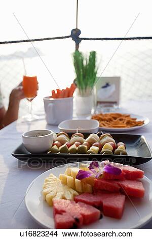 Trays of food on table View Large Photo Image Picture - Trays of food on table. Fotosearch