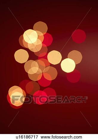 Stock Photo - Unfocussed lights on red background. Fotosearch