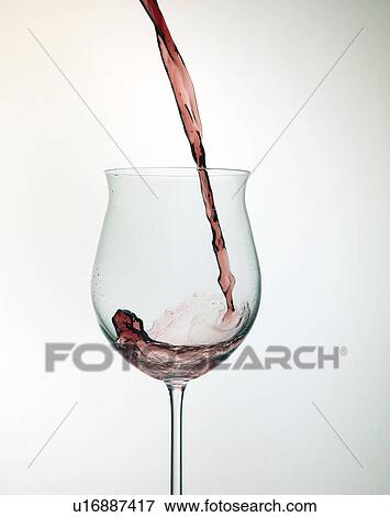 Stock Photo - Wine pouring in glass. Fotosearch