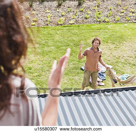 Woman arguing with boyfriend in backyard View Large Photo Image Stock Photo - Woman arguing with boyfriend in backyard. Fotosearch