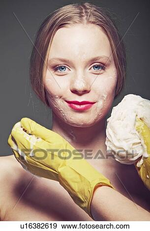 Woman having face scrubbed View Large Photo Image Stock Photo - Woman having face scrubbed. Fotosearch