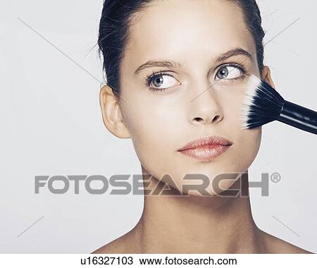 Woman having makeup applied View Large Photo Image Stock Image - Woman having makeup applied. Fotosearch