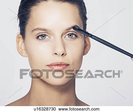 Woman having makeup applied View Large Photo Image Stock Image - Woman having makeup applied. Fotosearch