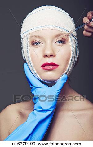 Woman in bandages having injection View Large Photo Image Stock Photo - Woman in bandages having injection. Fotosearch