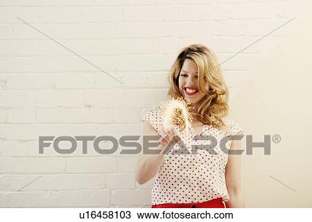 Woman painting with sparklers View Large Photo Image Stock Image - Woman painting with sparklers. Fotosearch