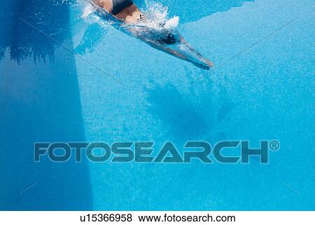 Stock Photo - Woman swimming in pool. Fotosearch