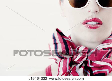 Woman wearing scarf and sunglasses View Large Photo Image Stock Image - Woman wearing scarf and sunglasses. Fotosearch