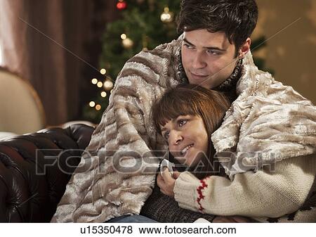 Stock Photo - Woman with boyfriend crying at movie. Fotosearch